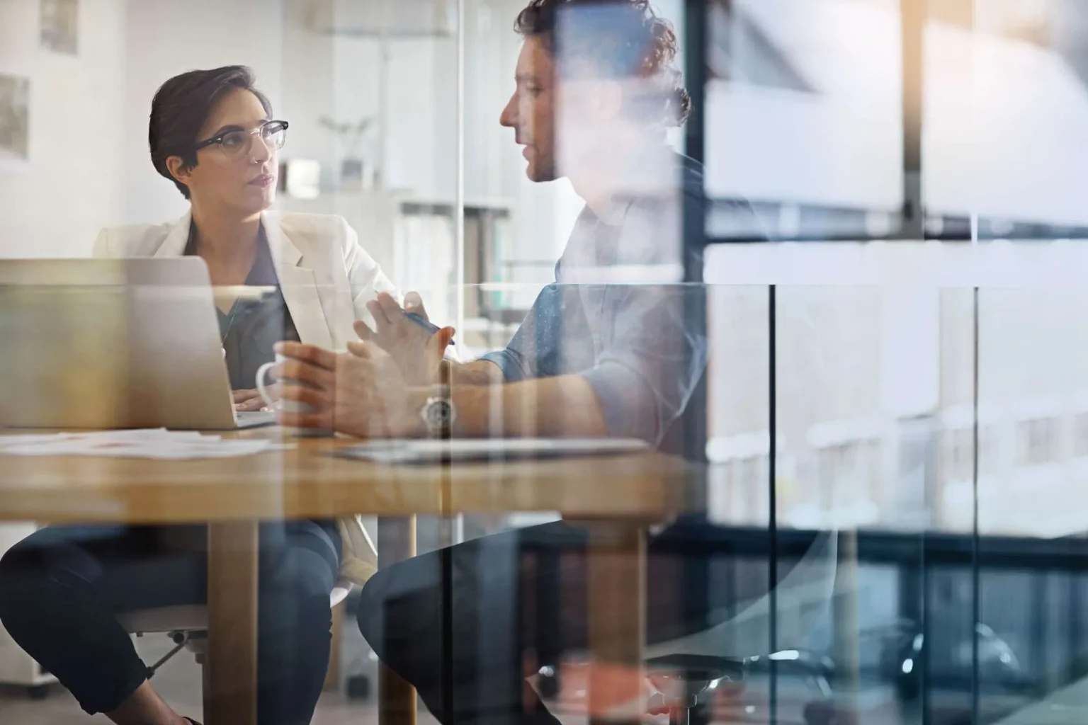 Business owner meeting with a web developer to talk through website repair options